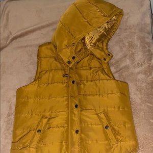 Puffer vest with a detachable hood
